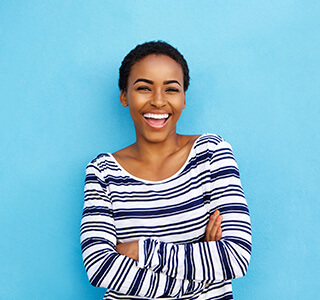 woman smiling with blue background