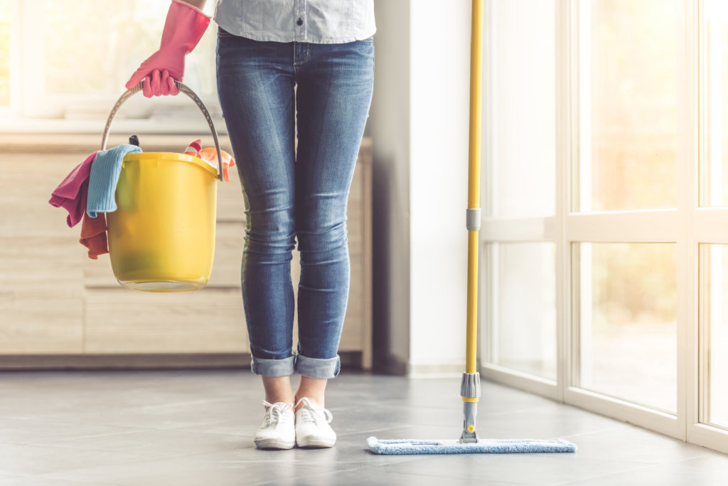 woman with cleaning supplies
