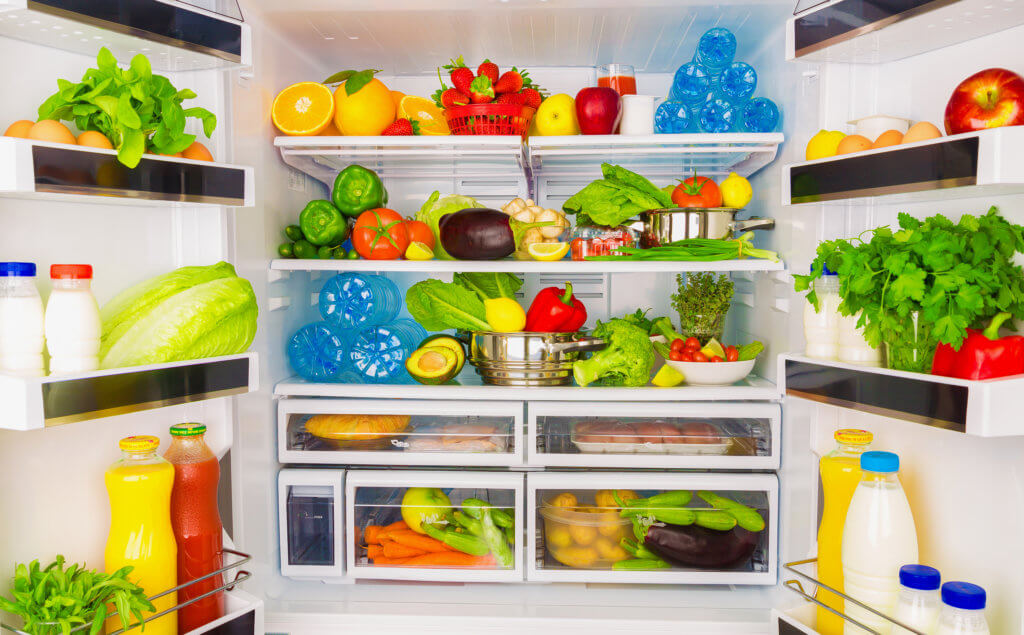 open refrigerator full of healthy foods