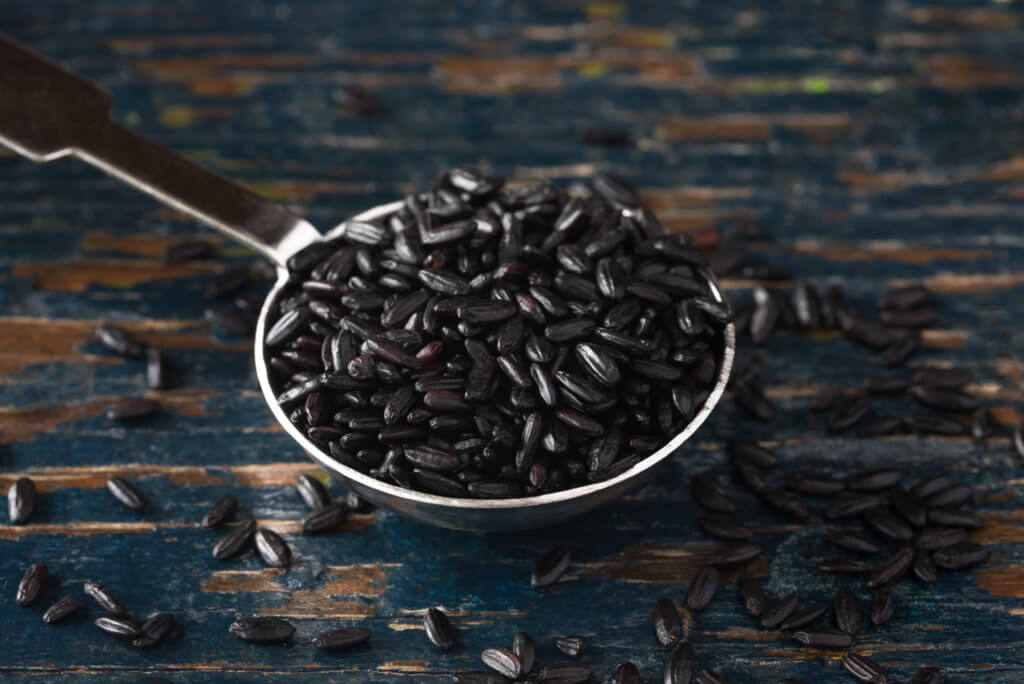 black rice on wood surface