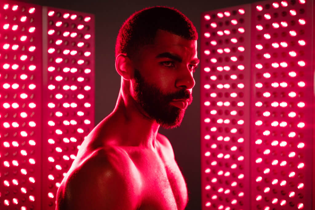 man is treated with red light therapy