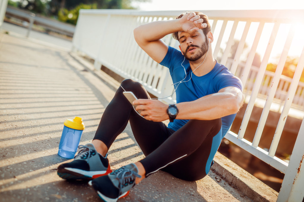 man is exhausted after exercising