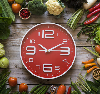 clock surrounded by food