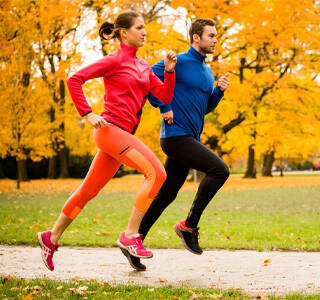 couple running in fall