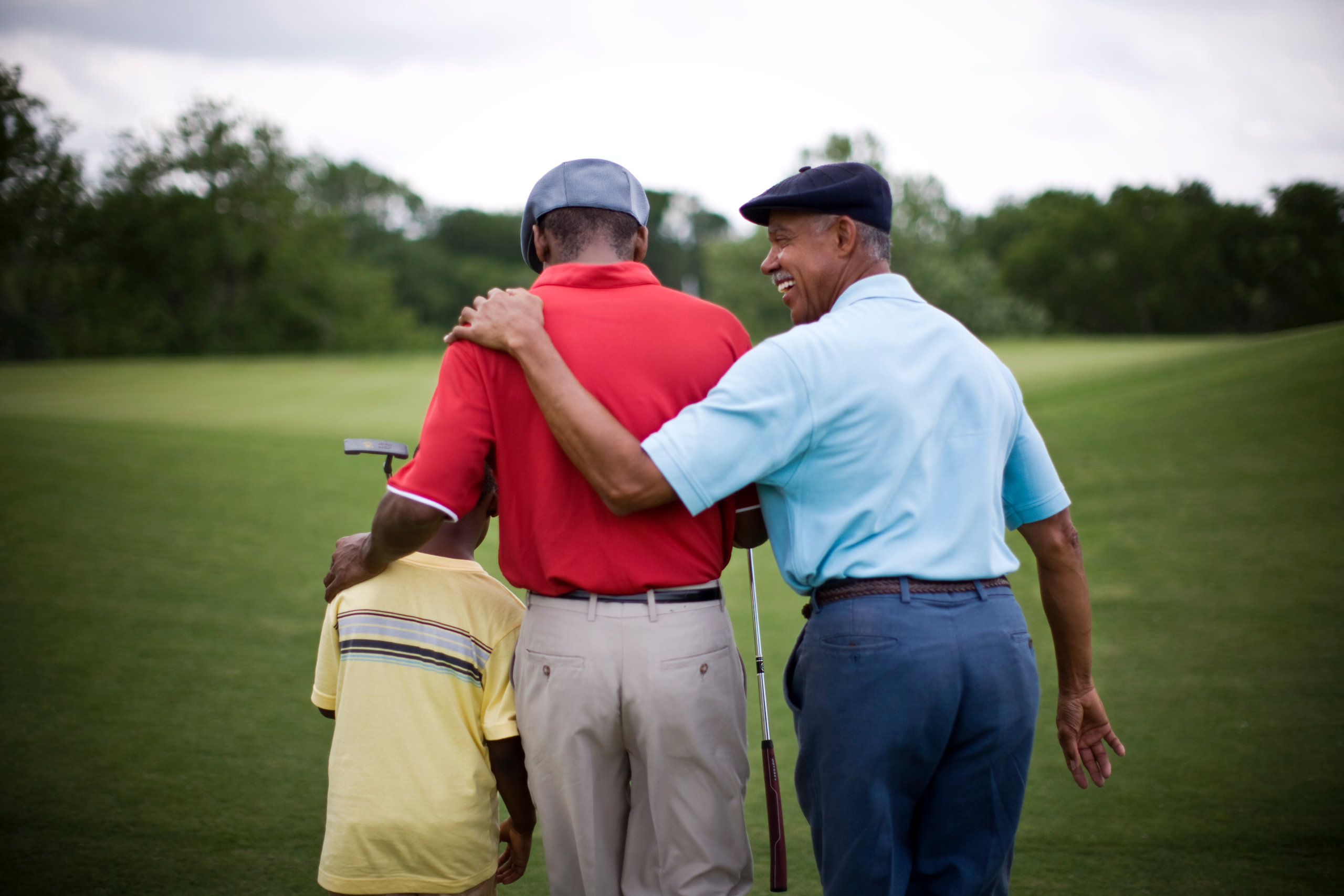 three men golfing
