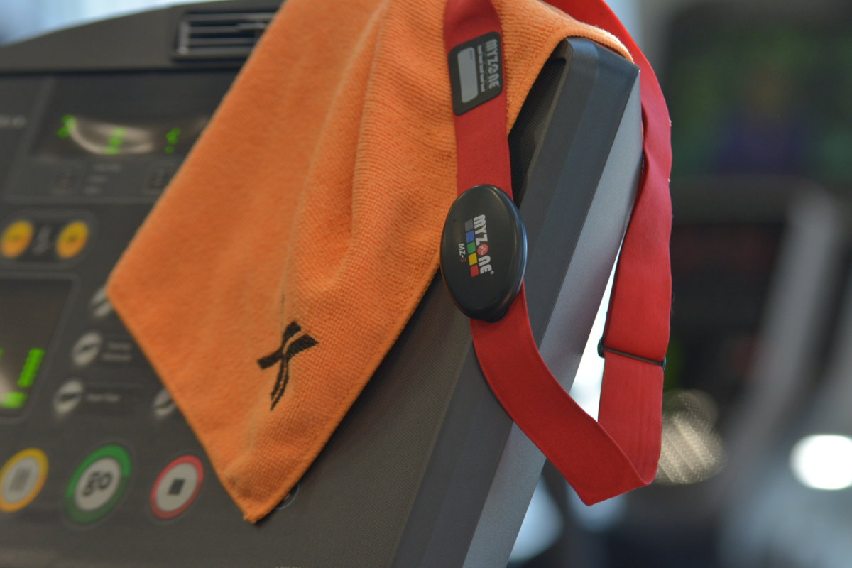 myzone belt and orange towel on treadmill